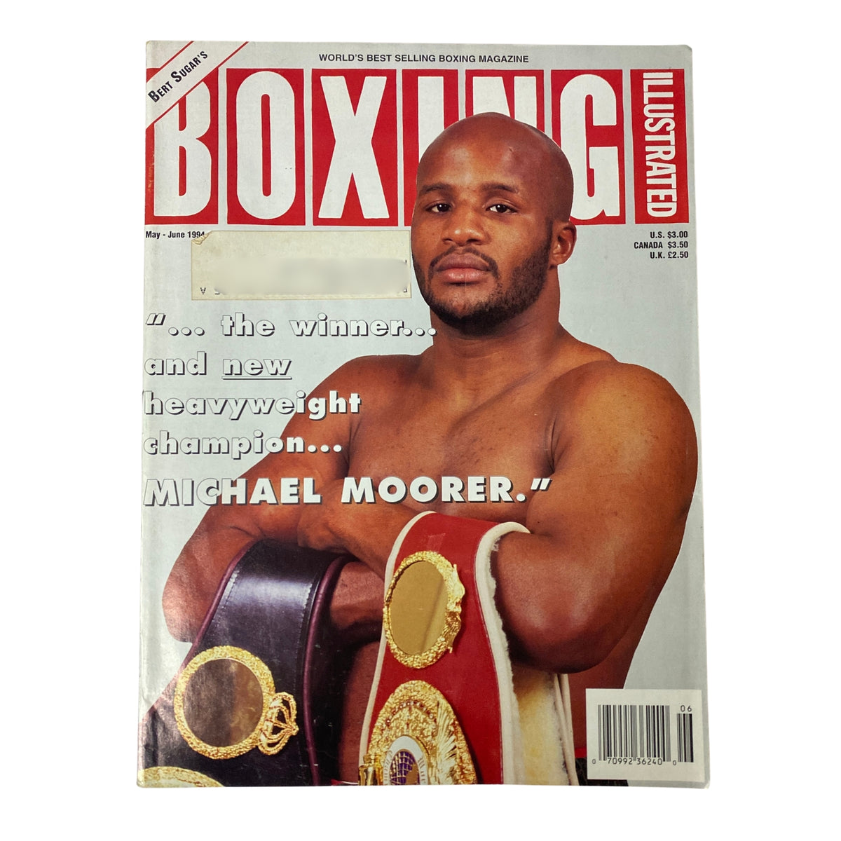 Cover of Boxing Illustrated Magazine May - June 1994 featuring heavyweight champion Michael Moorer with championship belts.