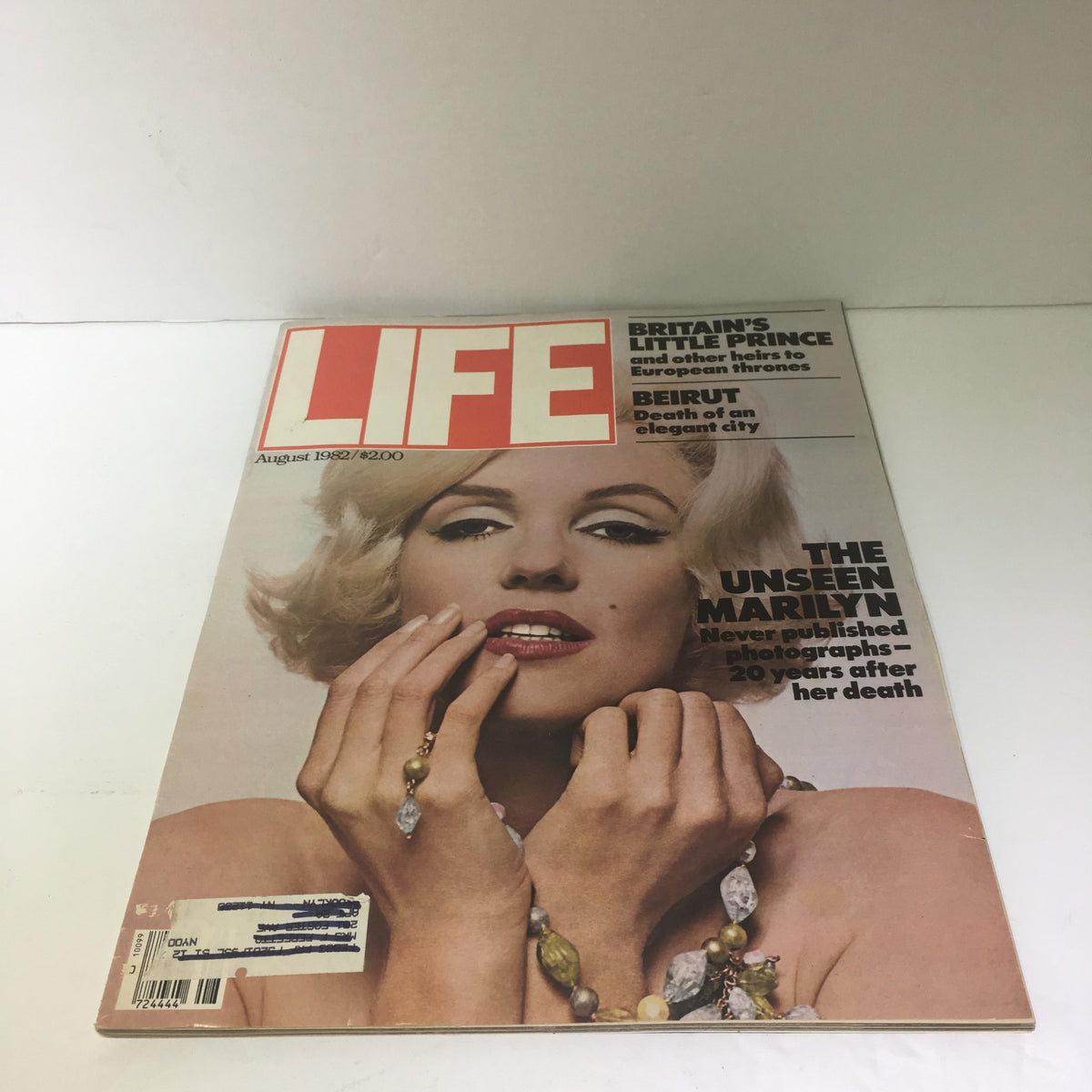Cover of Life Magazine: The Unseen Marilyn August 1982 featuring a close-up of Marilyn Monroe with stylish jewelry and her iconic look.