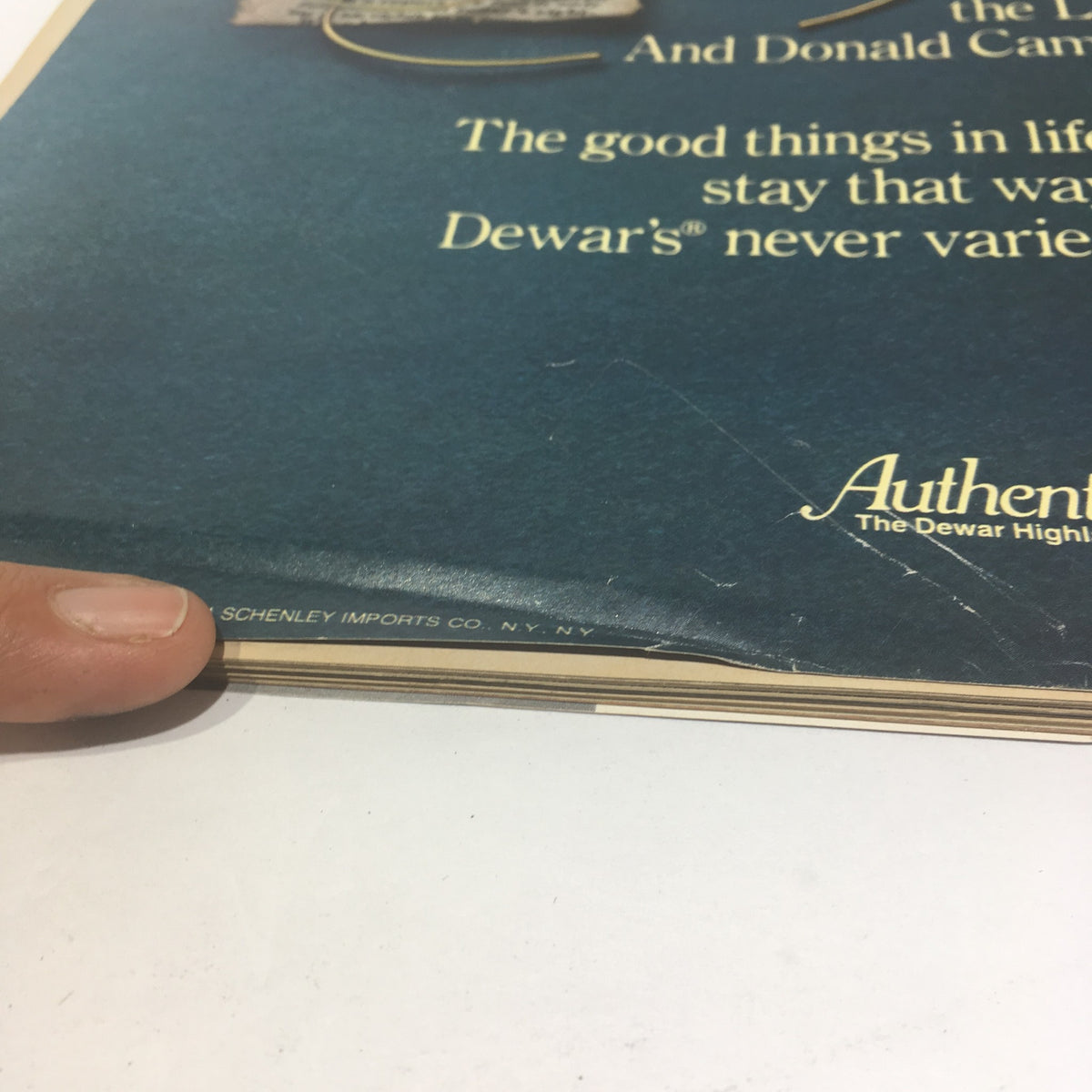 Side view of the Life Magazine showing its spine with wear, indicative of its vintage condition.