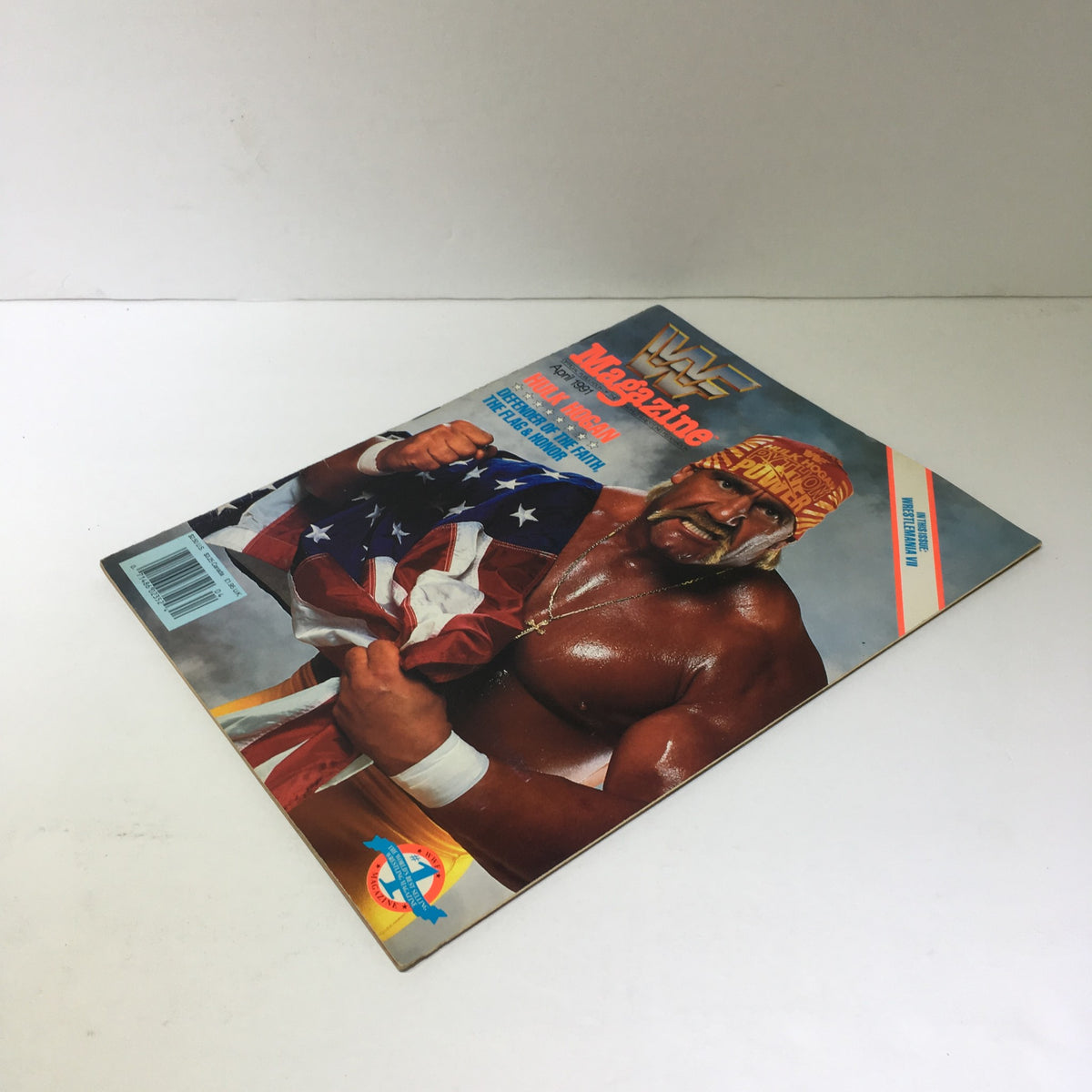 Cover image of WWF Magazine highlighting Hulk Hogan - Defender of Faith, Flag & Honor, April 1991, depicting Hulk Hogan with an American flag.