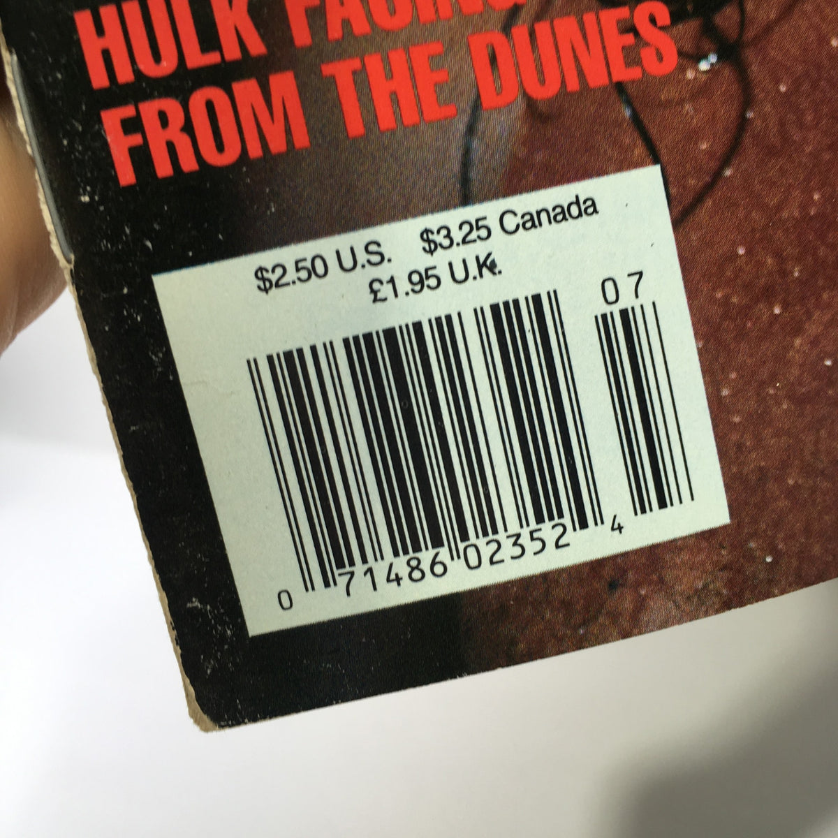 Barcode on the back cover of WWF Magazine, July 1991 issue, with pricing details for U.S., Canada, and U.K.
