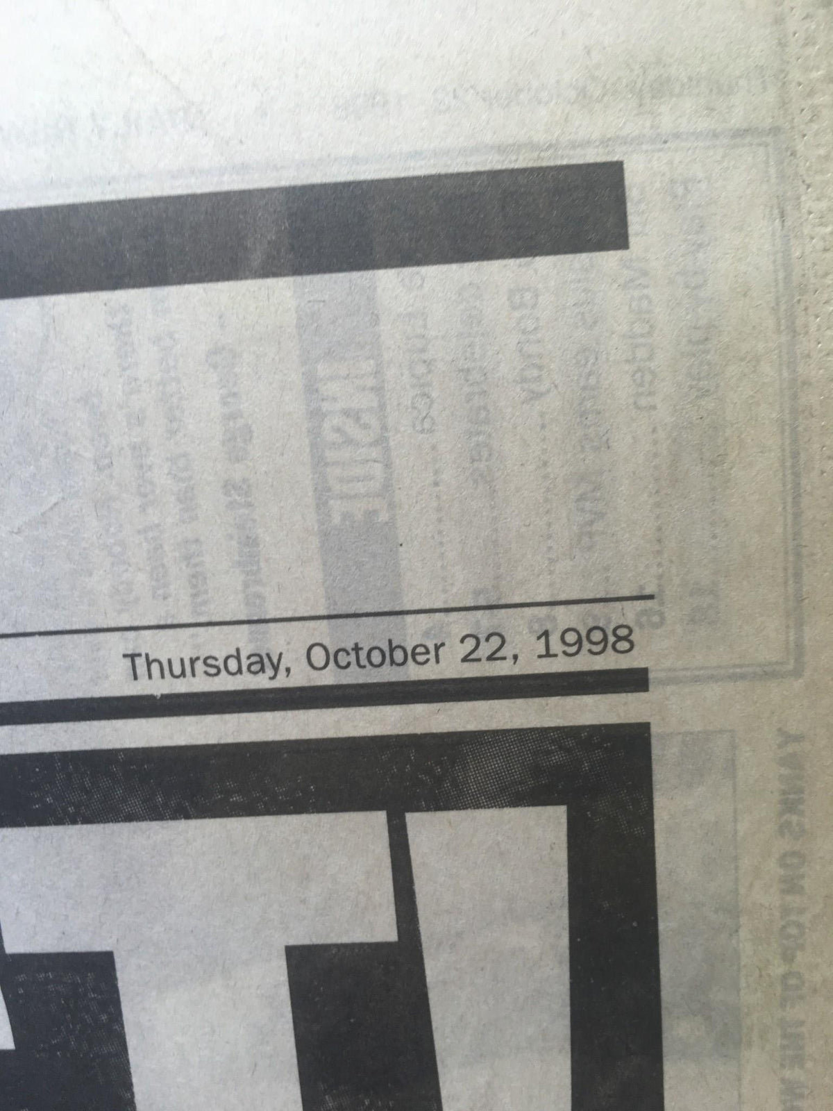Close-up image showing the date on the New York Daily News issue from October 22, 1998, commemorating the greatest Yankees sweep of the San Diego Padres in the World Series.