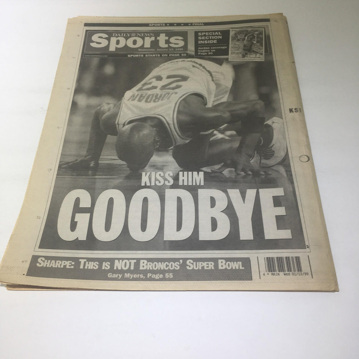 NY Daily News front page featuring the headline 'KISS HIM GOODBYE' with Michael Jordan's iconic number 23 jersey, indicating a significant sports moment.