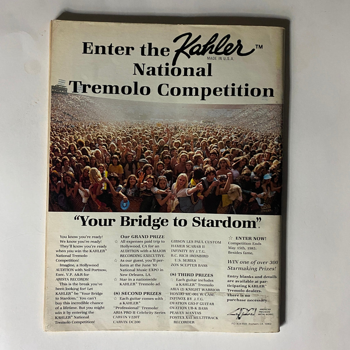 Back cover of VTG Guitar Magazine April 1985 promoting the Kahler National Tremolo Competition, featuring a crowd at a rock concert.