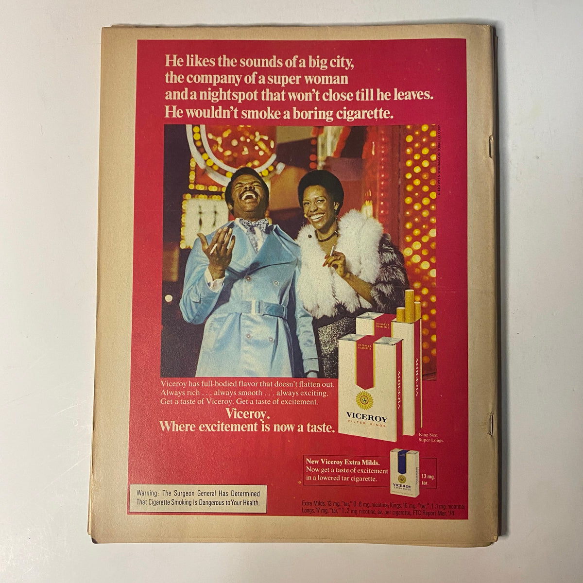 Back cover advertisement from the Black Sports Magazine – September 1974 issue featuring Muhammad Ali vs. George Foreman. The ad promotes Viceroy cigarettes with imagery of a glamorous couple enjoying a nightlife scene.