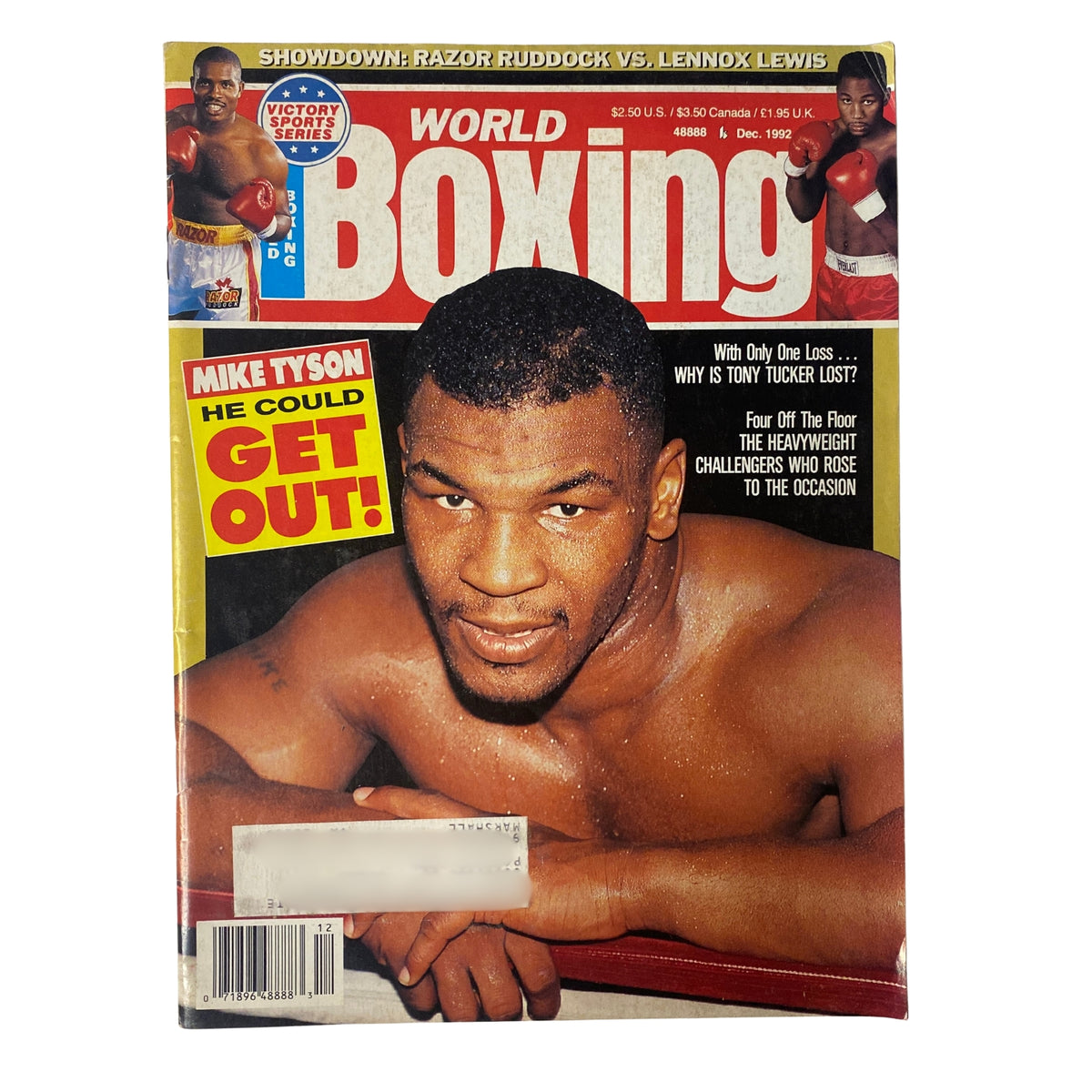 World Boxing Magazine December 1992 cover featuring Mike Tyson with the headline 'He Could Get Out!'. Highlights Razor Ruddock vs. Lennox Lewis showdown.