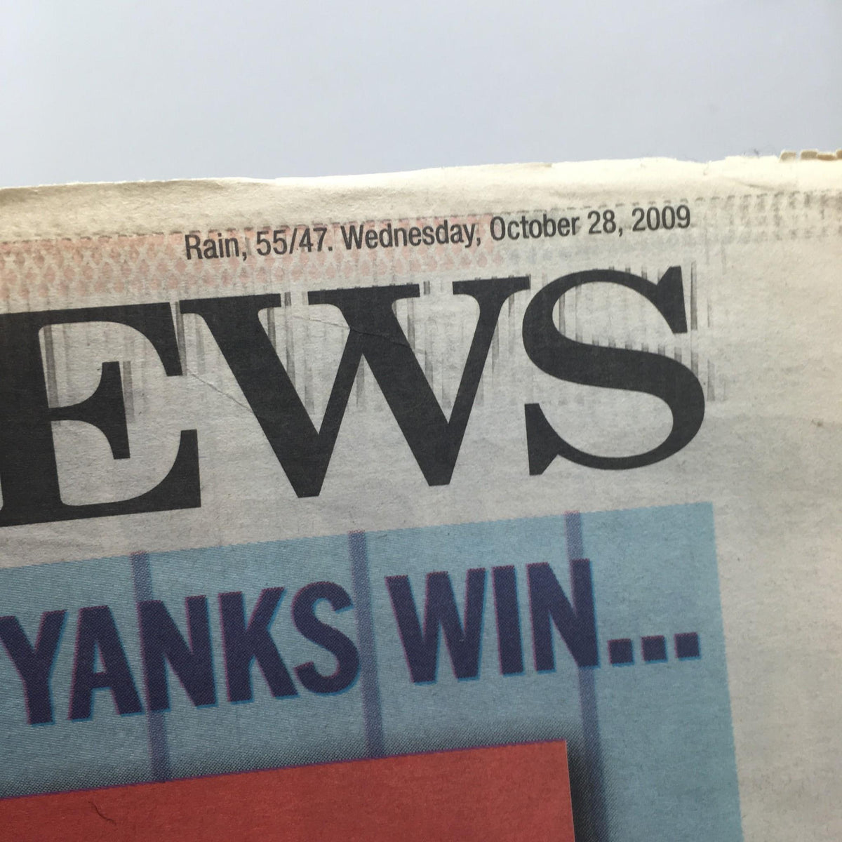 Section of NY Daily News from October 28, 2009, showing the date and weather information, related to the article titled 'It'll Be Heaven When Yanks Win 27'.