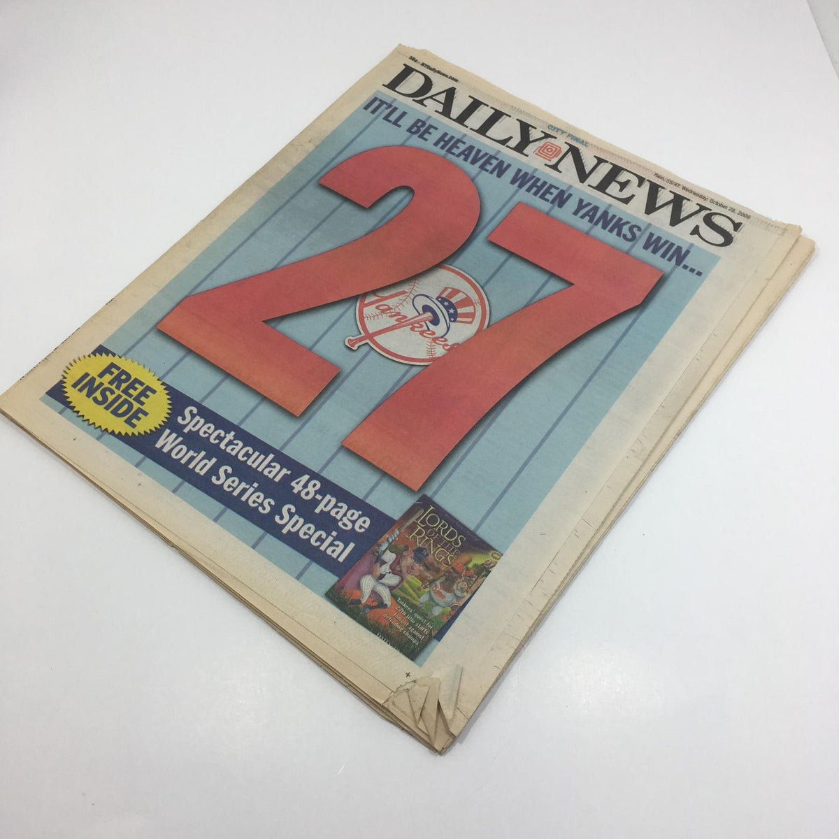 Back view of NY Daily News from October 28, 2009, displaying the cover with the headline 'It'll Be Heaven When Yanks Win 27' and additional details.
