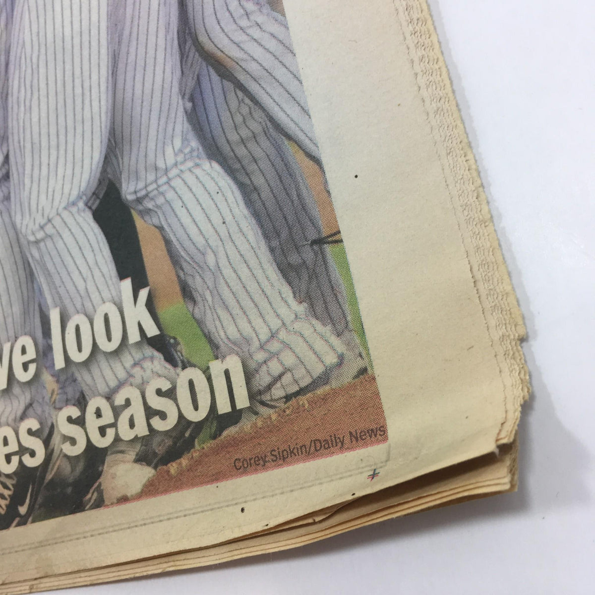 Image of the NY Daily News commemorative edition titled 'Road to Glory: A Commemorative Look at the 2009 Yanks Season', showcasing players celebrating with visible pinstripe uniforms.