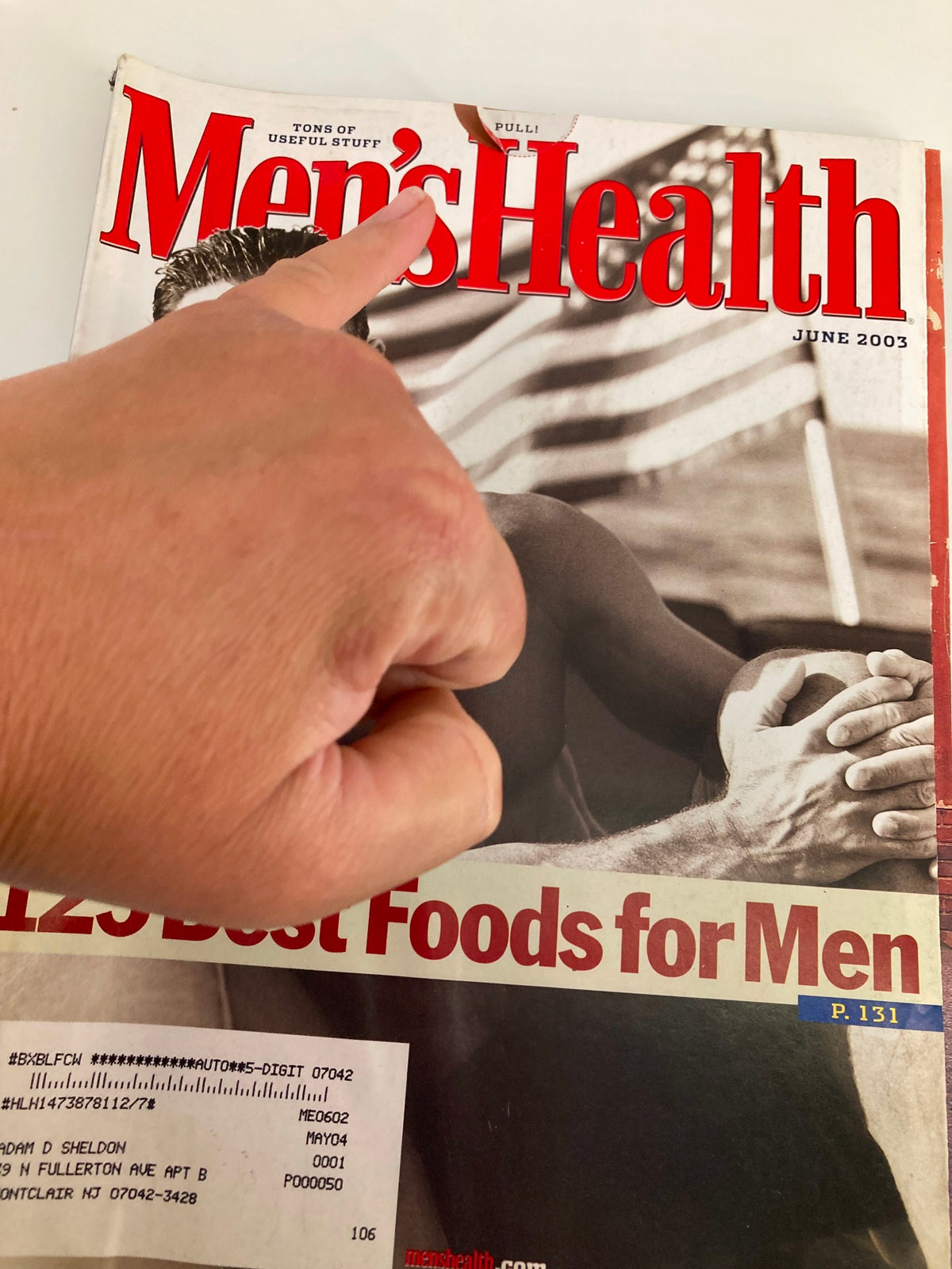Close-up view of the Men's Health Magazine June 2003 cover, highlighting the title and section on '125 Best Foods for Men.'