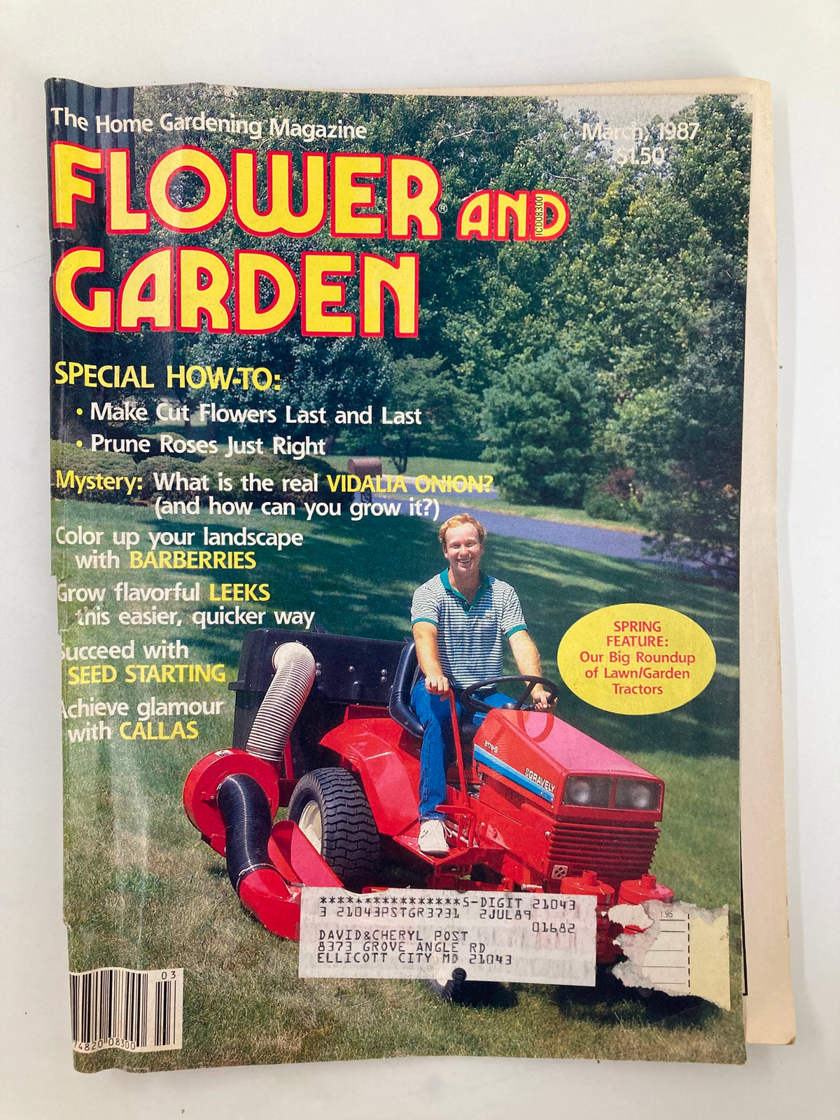 Cover of the Vintage Flower and Garden Magazine from March 1987 showcasing a big roundup of lawn and garden tractors, featuring a man operating a red lawn tractor with tips for gardening enthusiasts.