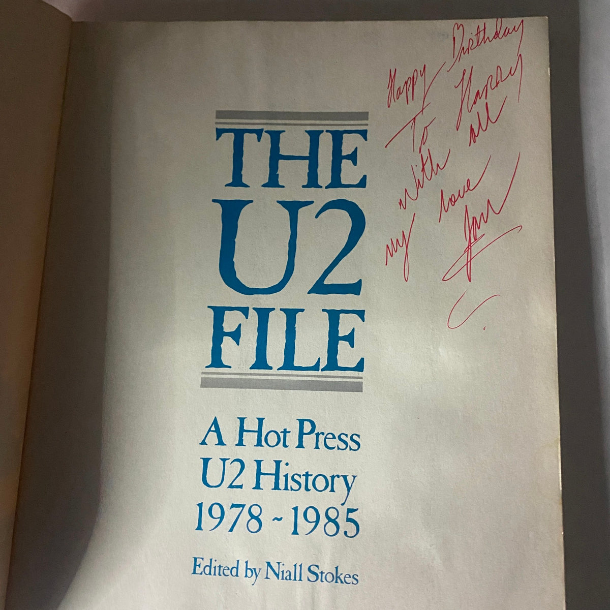 The U2 File: A Hot Press U2 History, signed inside by the editor Niall Stokes, showcasing a personal birthday message.