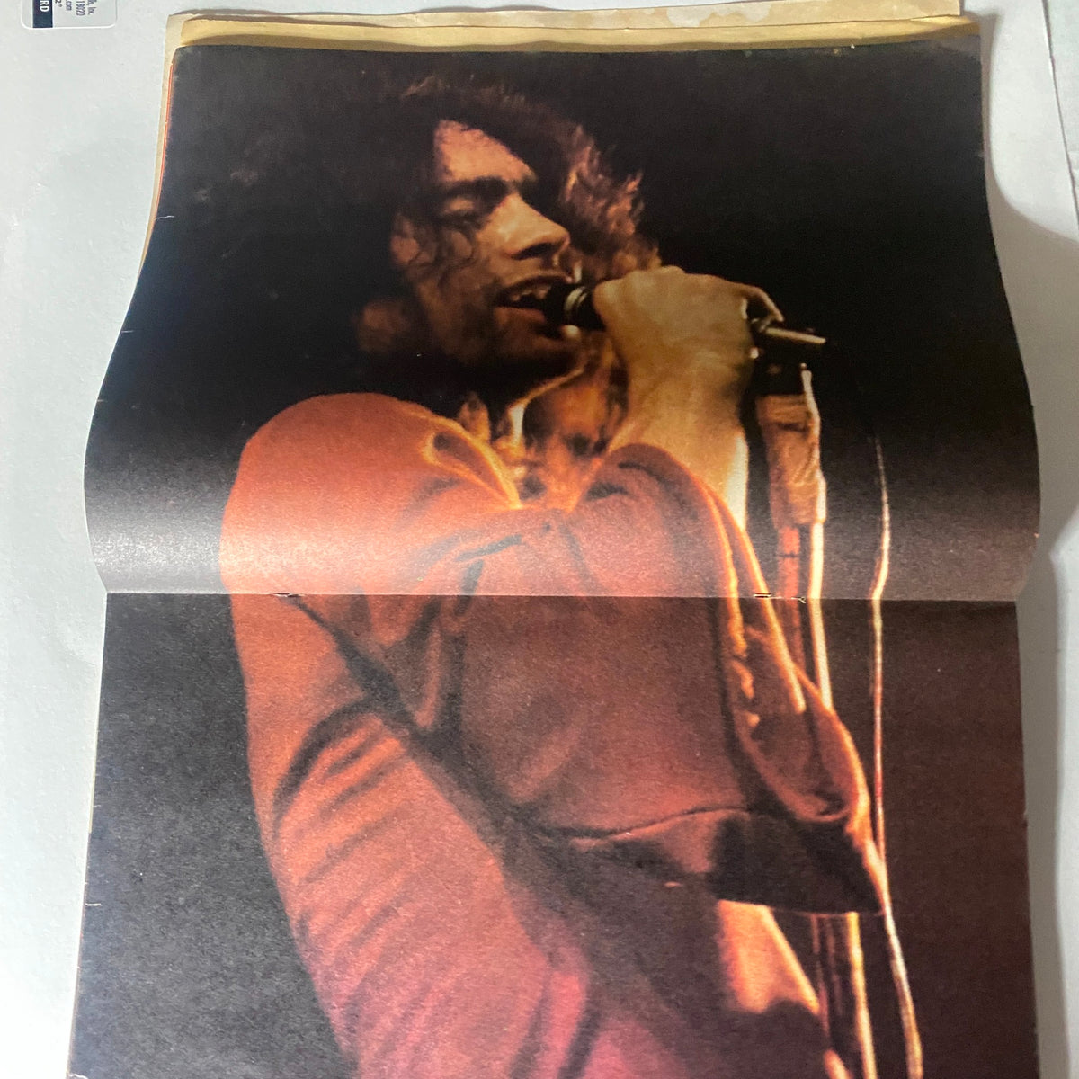 Centerfold of VTG Hit Parader Magazine August 1975, displaying a stunning photo of a rock musician performing passionately on stage.