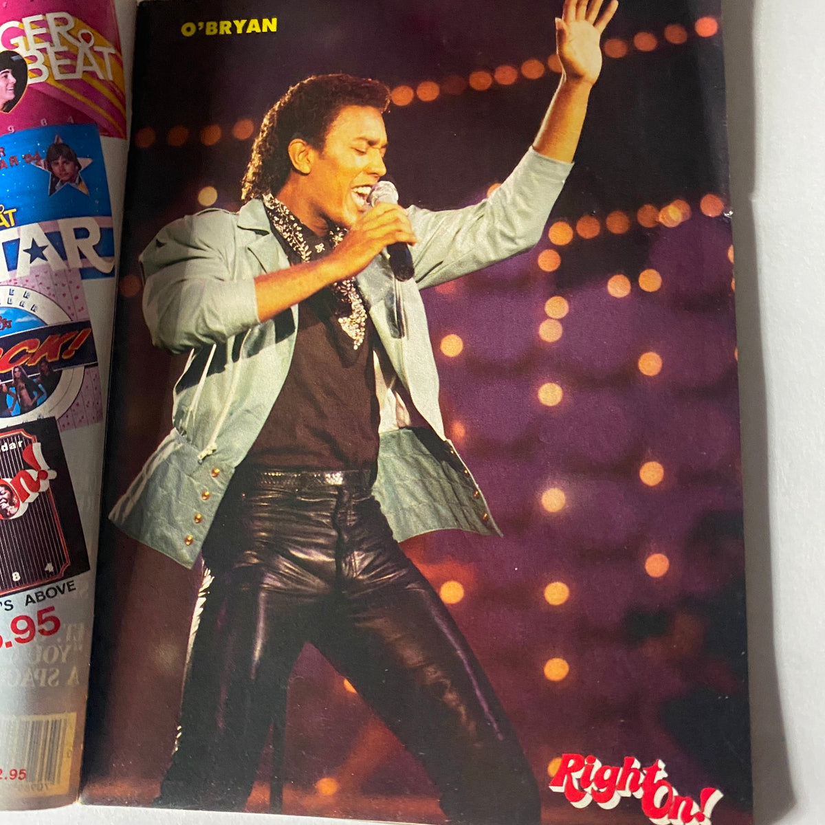 O'Bryan performing energetically on stage, featured in the VTG Right On Magazine December 1983 Vol 14 No. 3, highlighting the musical culture of the 1980s.