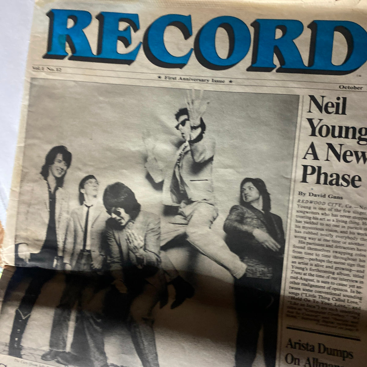 Inside page of Neil Young Vintage Record Magazine - October 1982, Vol 1 No. 12 showcasing an article about Neil Young with a group of musicians.