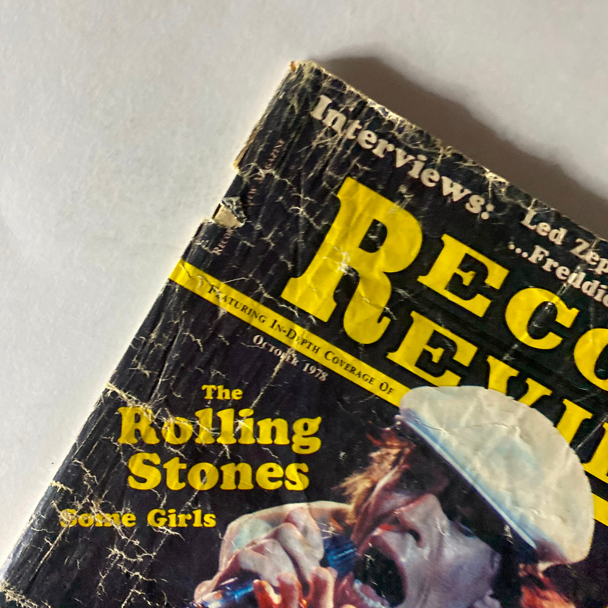 Close-up of the cover of VTG Record Review Magazine October 1978, prominently displaying the title 'Record Review' and 'The Rolling Stones' with a vibrant image of Mick Jagger performing. The magazine captures the essence of rock history from the era.