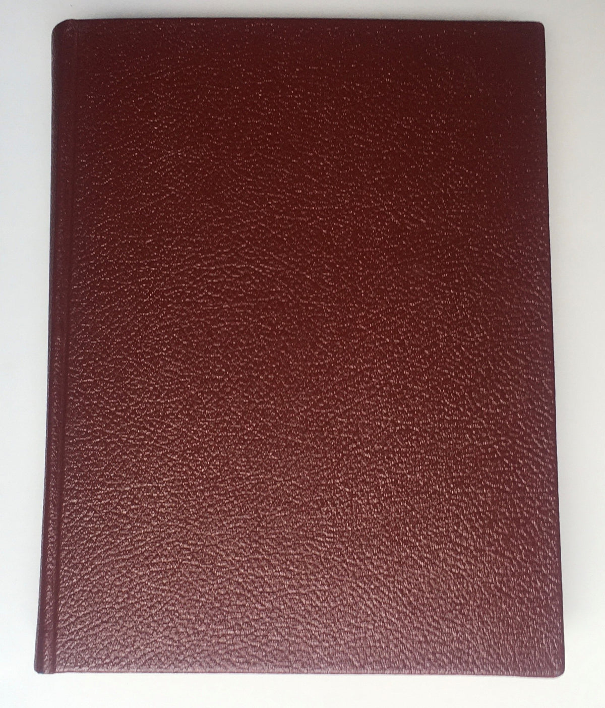 Cover of the 1967 Woman's Day Magazine Compilation showcasing a textured burgundy cover, highlighting its vintage nature and collectible status.