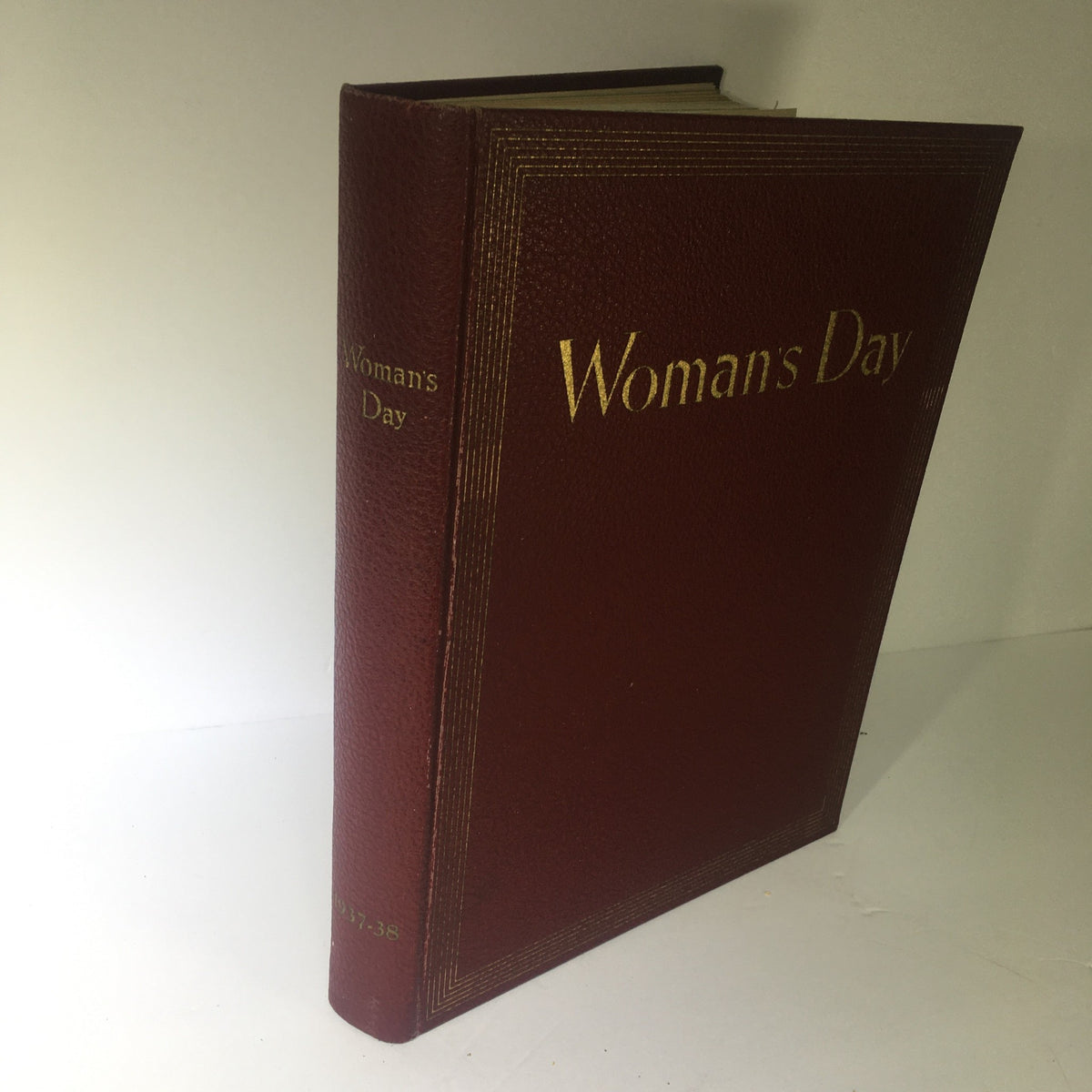 1937-1938 Woman's Day Magazine Compilation showing the side view of the hardcover edition with embossed title on the spine.