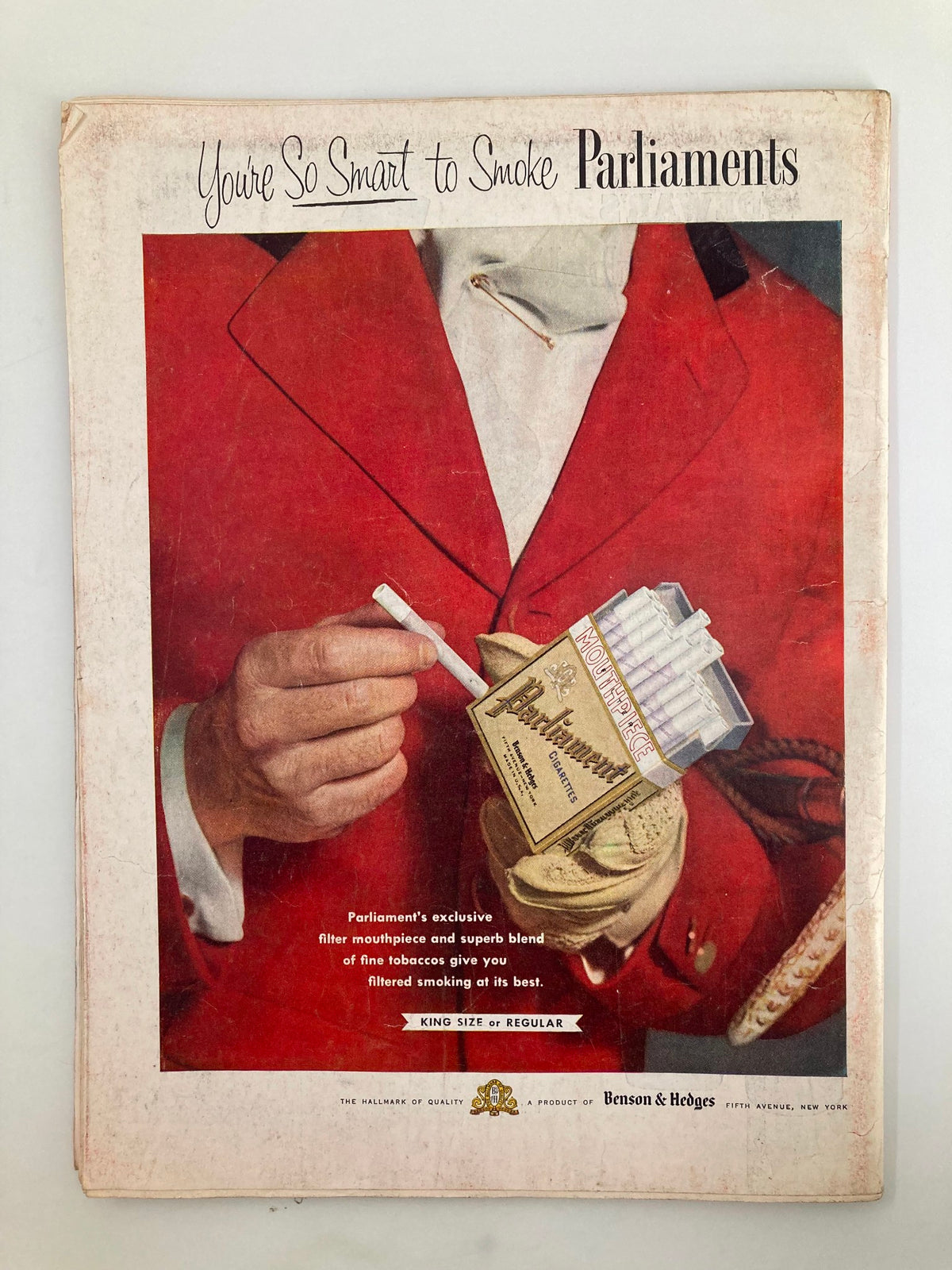 Back cover advertisement from VTG Time Magazine October 25 1954 for Parliament cigarettes, displaying a gentleman in a red coat holding cigarettes, exemplifying 1950s marketing trends.