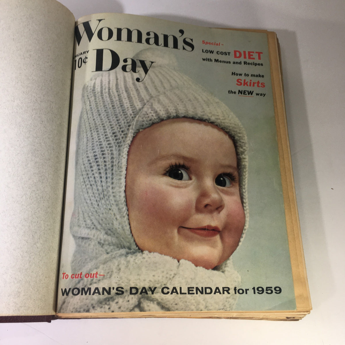 1959 Woman's Day Magazine Compilation displaying the January 1959 cover, featuring a baby in a knit cap, illustrating vintage magazine aesthetics.