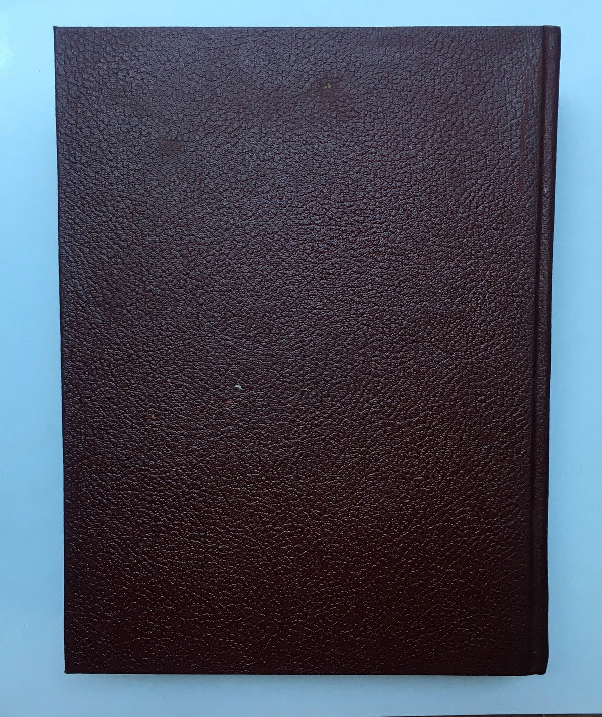 The hardcover spine of the 1959 Woman's Day Magazine Complete Year Round Compilation, showing a rich textured burgundy finish.