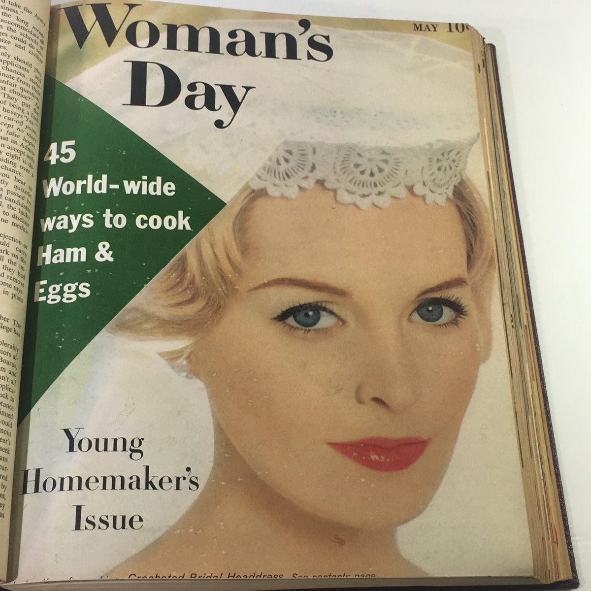 Cover image of the 1958 Woman's Day Magazine showcasing a woman with blue eyes in a bridal headpiece, titled 'Young Homemaker's Issue'.