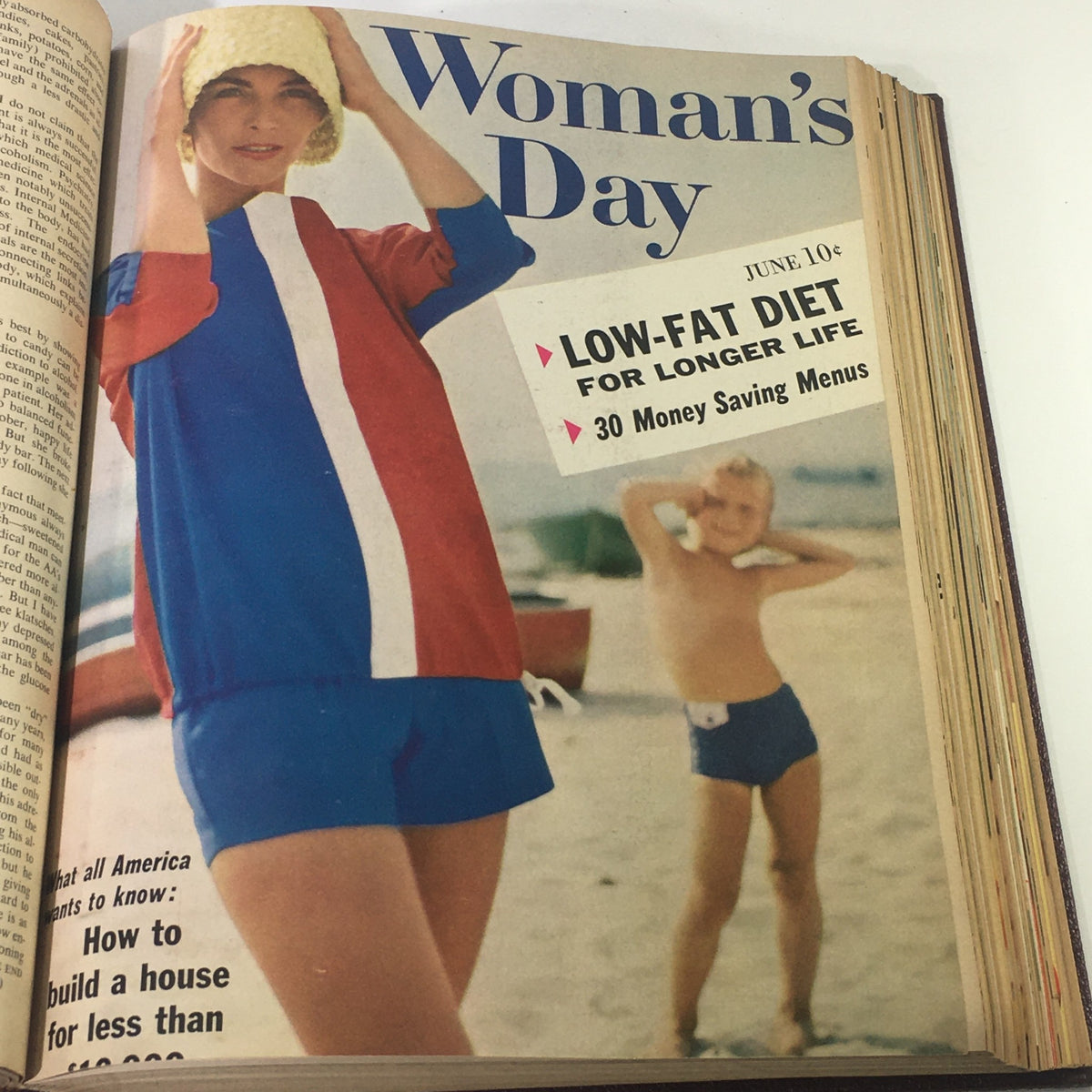 Cover image of the 1958 Woman's Day Magazine featuring a woman in a beach outfit and a boy, with the title 'Low-Fat Diet for Longer Life'.