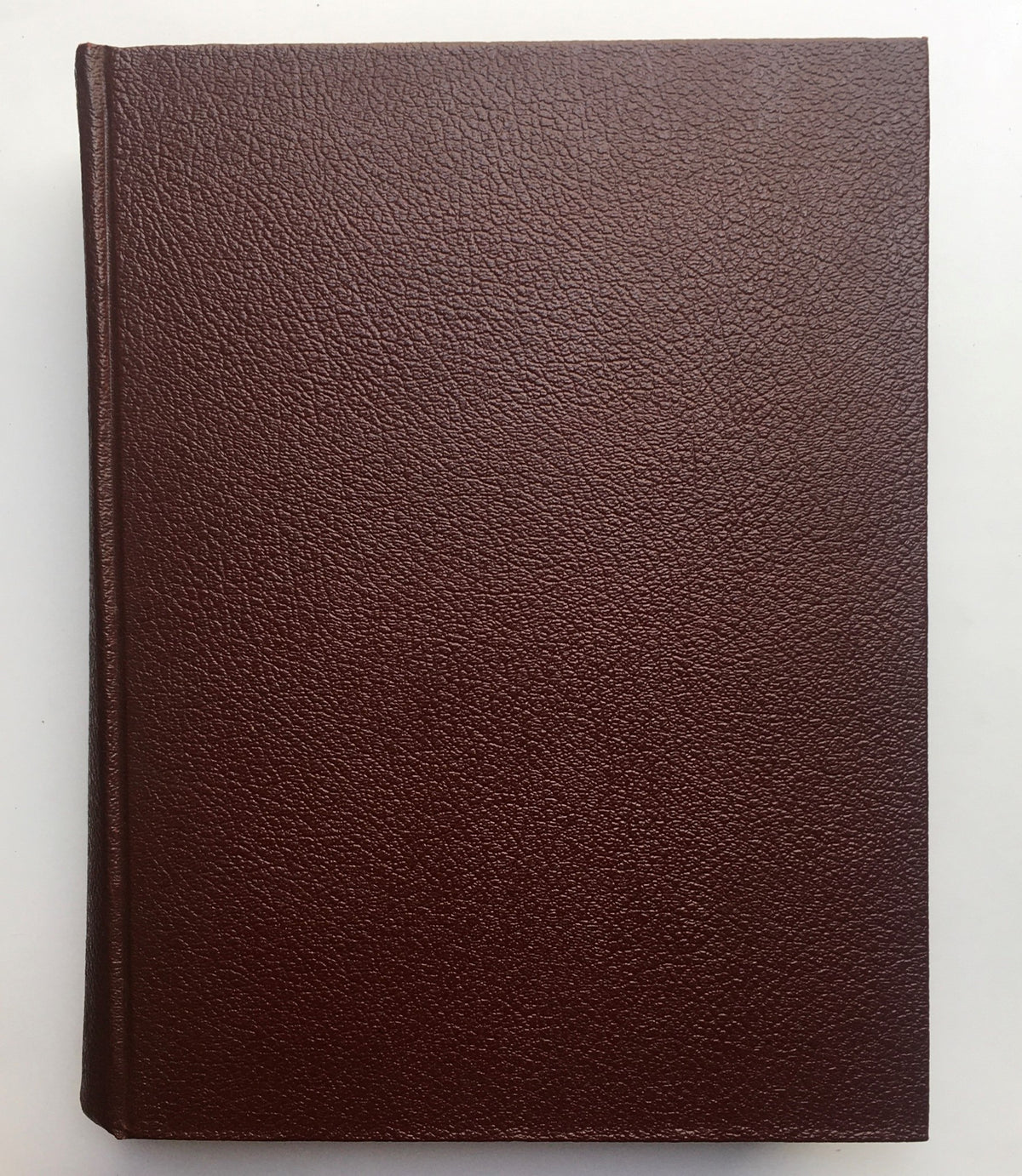 Cover of the 1957 Woman's Day Magazine compilation in good condition, showcasing a textured brown leather design.