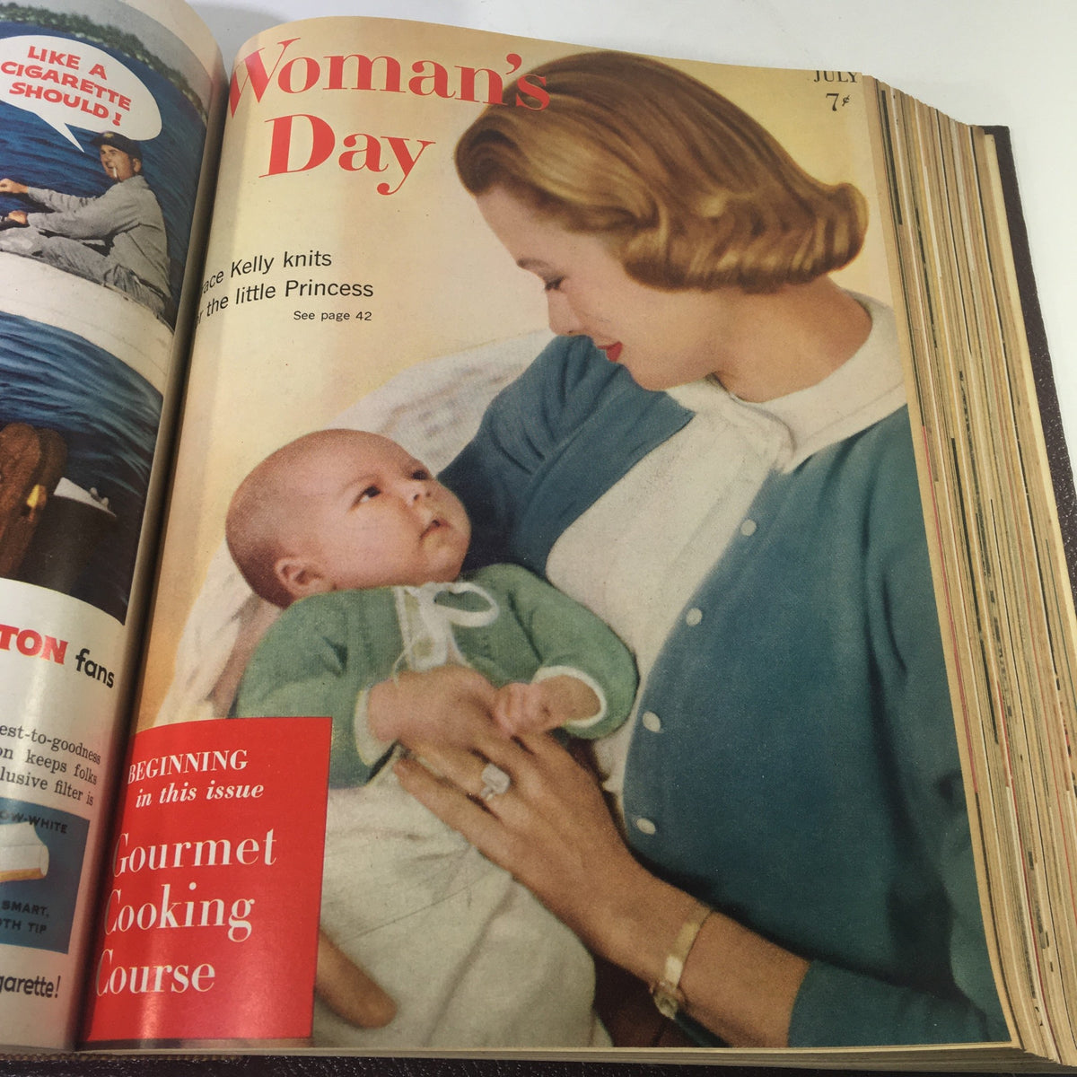 Cover of July 1957 Woman's Day Magazine featuring a mother and baby, highlighting articles on parenting.