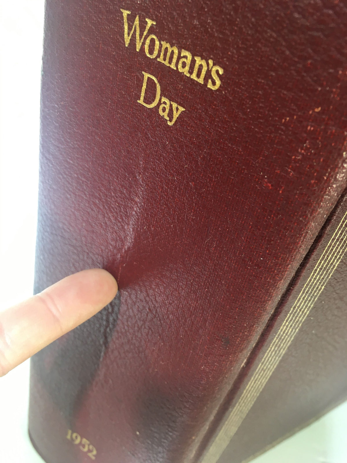 Close-up of the 1952 Woman's Day Magazine Complete Year Round In One Book Compilation displaying the texture and minor wear of the cover.