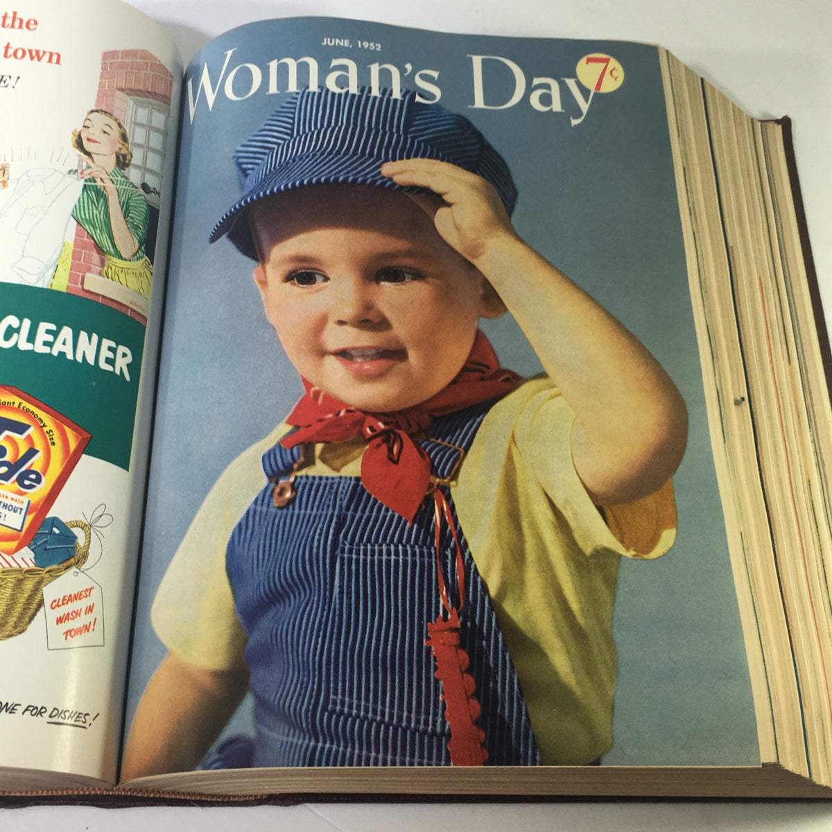Cover page of June 1952 issue from the 1952 Woman's Day Magazine Complete Year Round In One Book Compilation, featuring a young boy in a conductor's outfit, symbolizing the playful spirit of childhood.