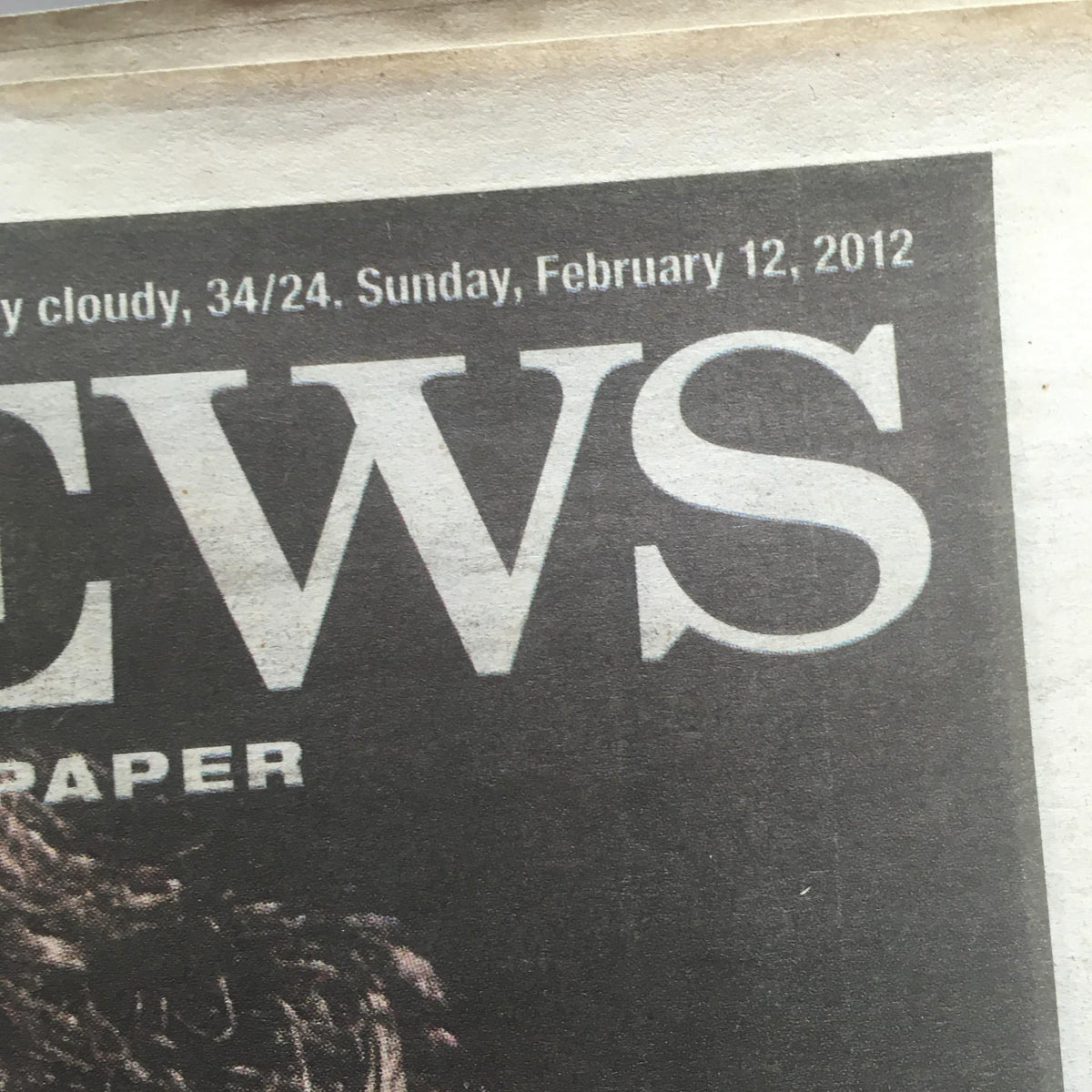 Close-up of the New York Daily News logo and date, Sunday, February 12, 2012, on the front page announcing Whitney Houston's death.