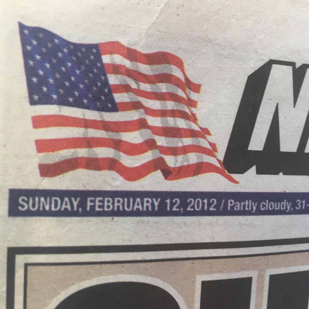 Close-up of the New York Post dated February 12, 2012, showing the date and weather section. This edition features the headline 'Queen of Pop Dead' with coverage on Whitney Houston.