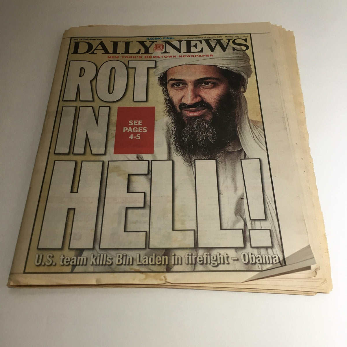 Cover of NY Daily News dated May 2, 2011, featuring the headline 'Rot in Hell! U.S. team kills Bin Laden in firefight' with an image related to Osama Bin Laden.