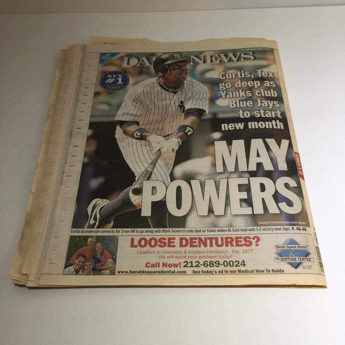 Cover of NY Daily News from May 2, 2011, featuring headline 'Curtis, Tex go deep as Yanks Club Blue Jays to start new month' alongside a baseball player.