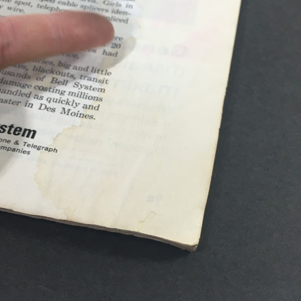 Close-up of text and wear on a page from 'VTG The Saturday Evening Post May 7 1966', illustrating vintage magazine condition.