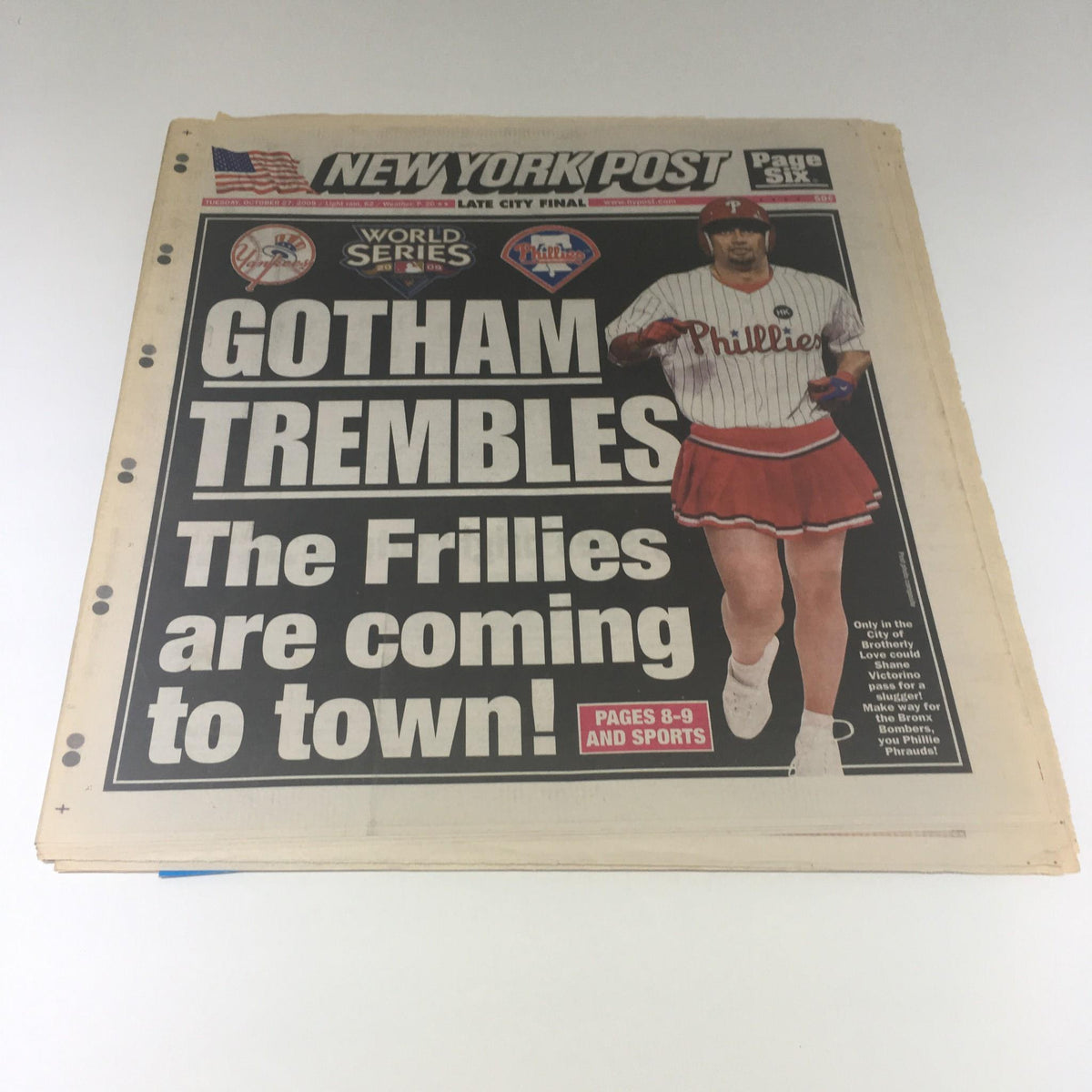 Front cover of the New York Post dated October 27, 2009. It features the headline 'GOTHAM TREMBLES: The Frillies Are Coming to Town!' alongside an image of a player in a Phillies uniform, marking the excitement of the World Series.