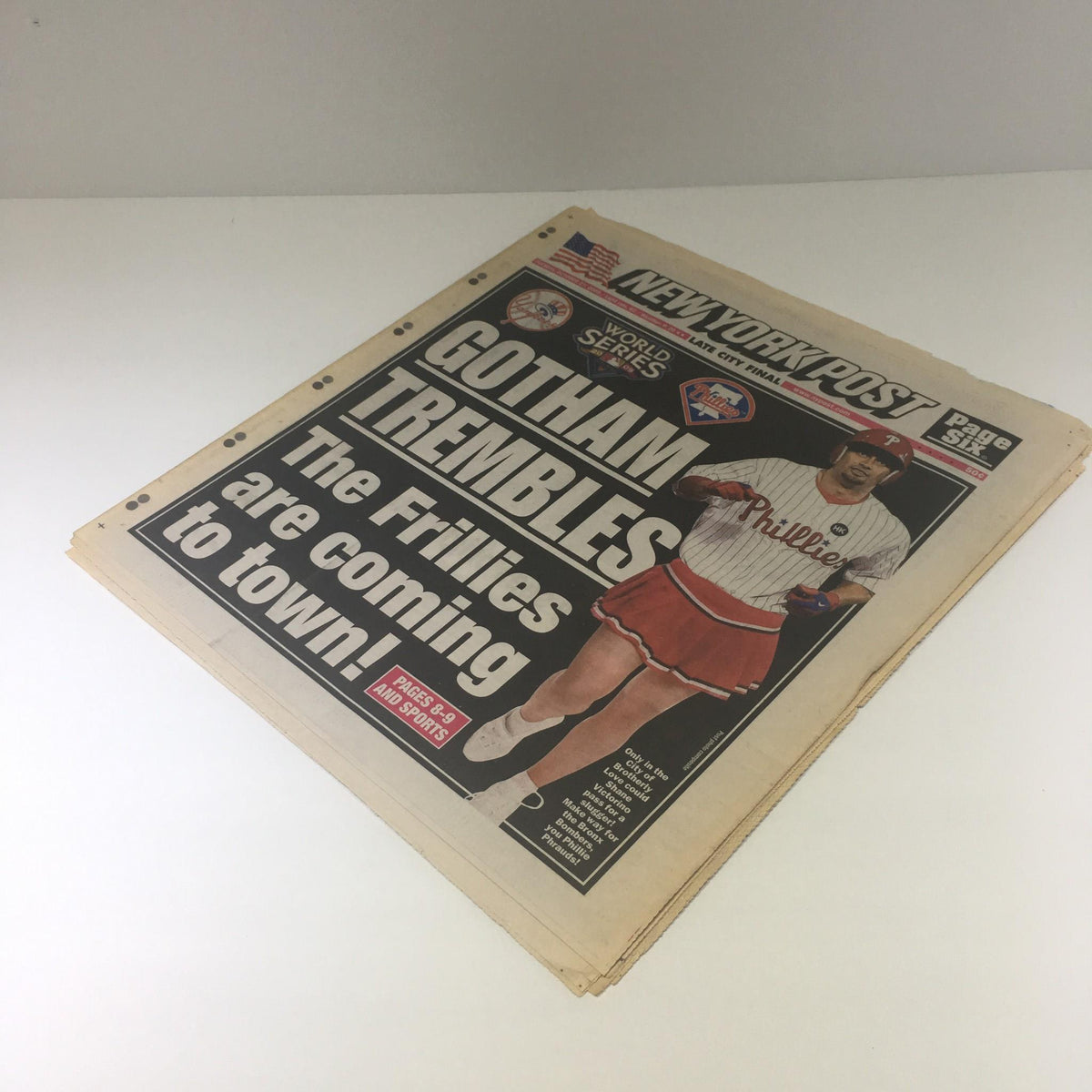 Another perspective of the New York Post dated October 27, 2009, showcasing the cover with the headline 'GOTHAM TREMBLES: The Frillies Are Coming to Town!' highlighting the excitement of the Philadelphia Phillies.