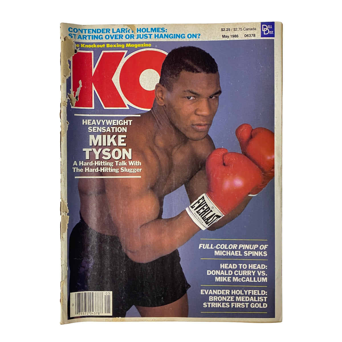 KO Boxing Magazine May 1986 cover featuring Mike Tyson, a heavyweight boxing sensation, showcasing a fierce pose with boxing gloves, highlighting his rising dominance in the sport.