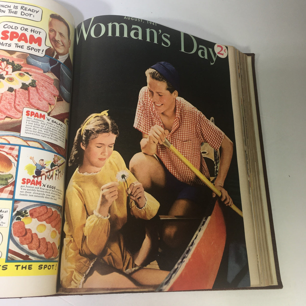1941 Woman's Day Magazine Compilation featuring a colorful summer scene with two girls in a boat, capturing the essence of leisure and women's lifestyle in August 1941.
