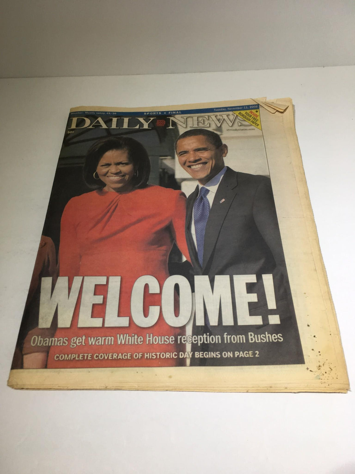 New York Daily News cover showing Barack Obama and Michelle Obama with the headline 'WELCOME! Obamas get warm White House reception from Bushes', dated November 11, 2008.