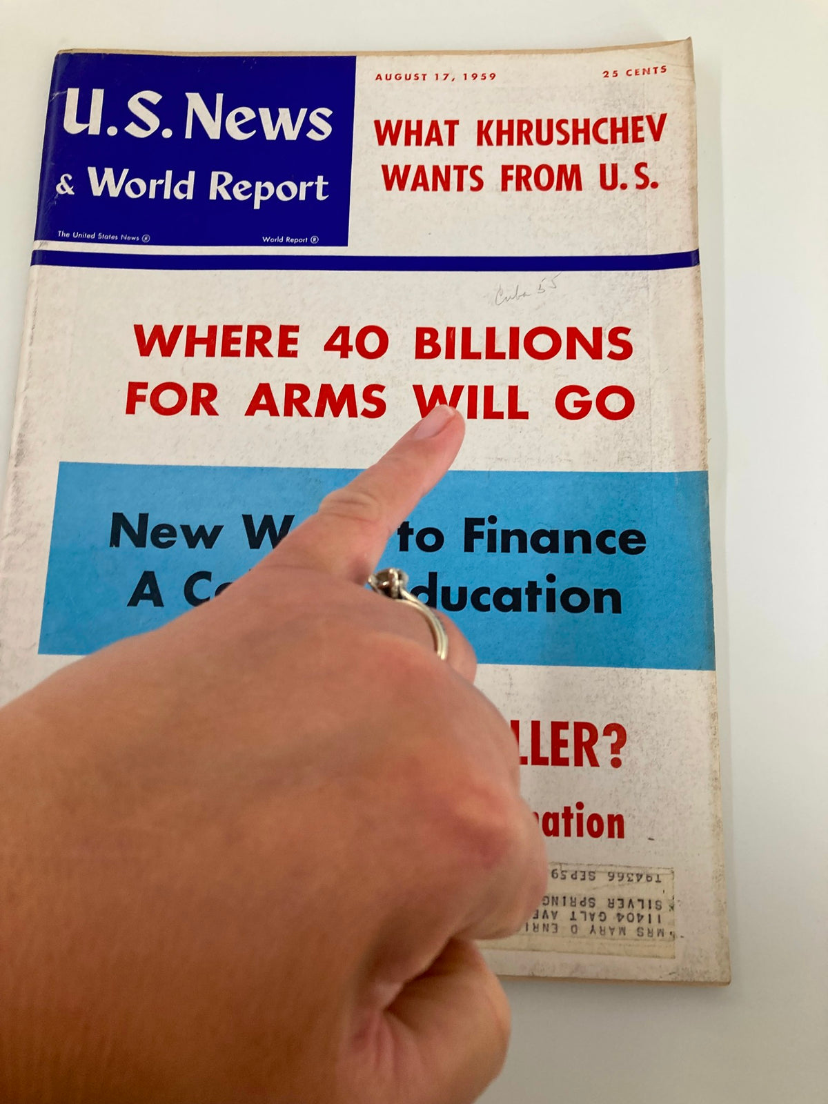 Close-up of the cover of US News & World Report Magazine from August 17, 1959, highlighting headlines about global arms discussion and educational finance.