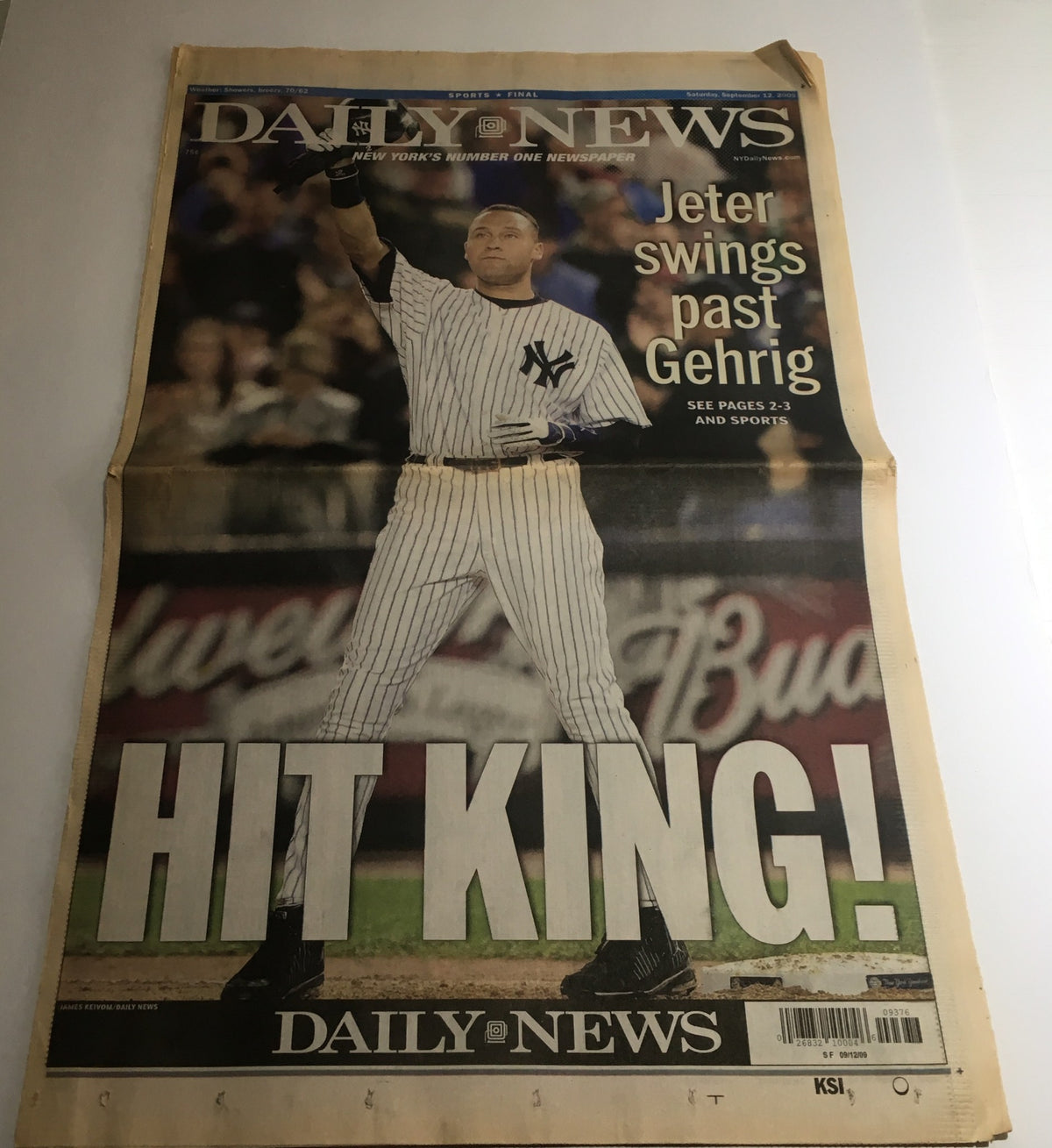NY Daily News cover from September 12, 2009, featuring Derek Jeter celebrating as he swings past Gehrig, with the headline 'HIT KING!'