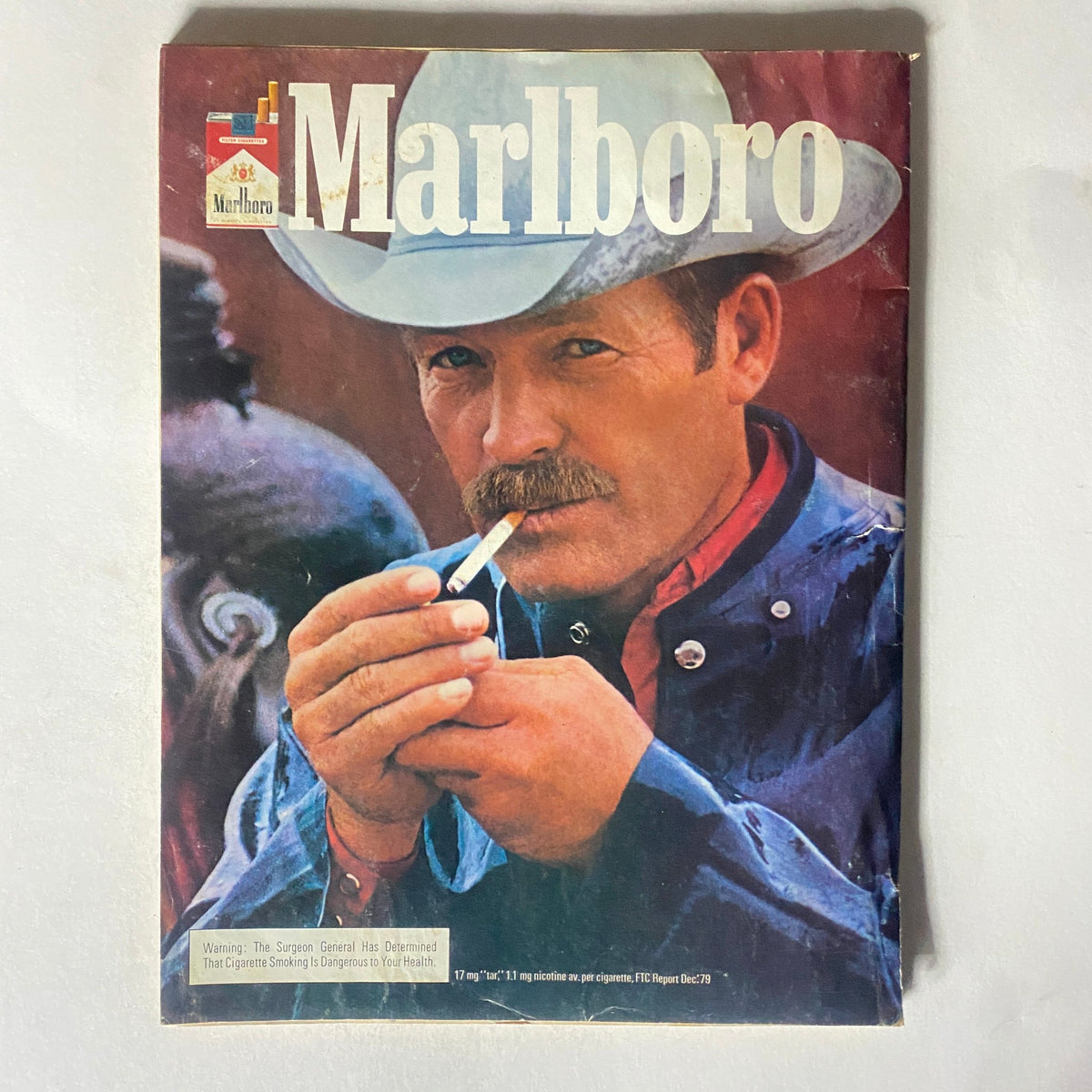 Cover of a vintage Marlboro magazine featuring a cowboy smoking a cigarette, promoting nostalgic Americana and outdoor lifestyle.