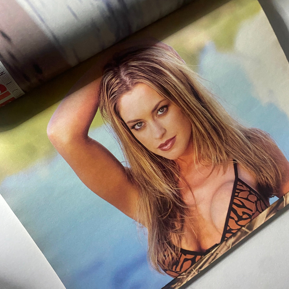 Centerfold image from Pump Magazine July 2000 showcasing a model in a stylish swimsuit, highlighting beauty and fitness.