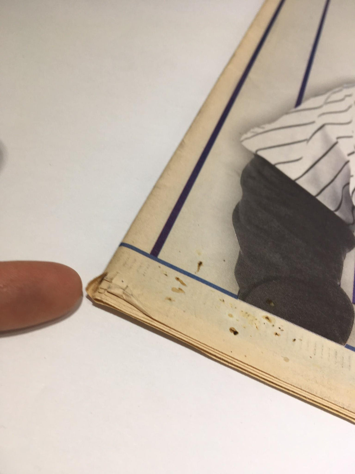 Corner detail of the NY Daily News issue from September 12, 2009, titled 'The King, The Hit, Hot Bat, Early Years Derek Jeter', showing slight wear on the page.
