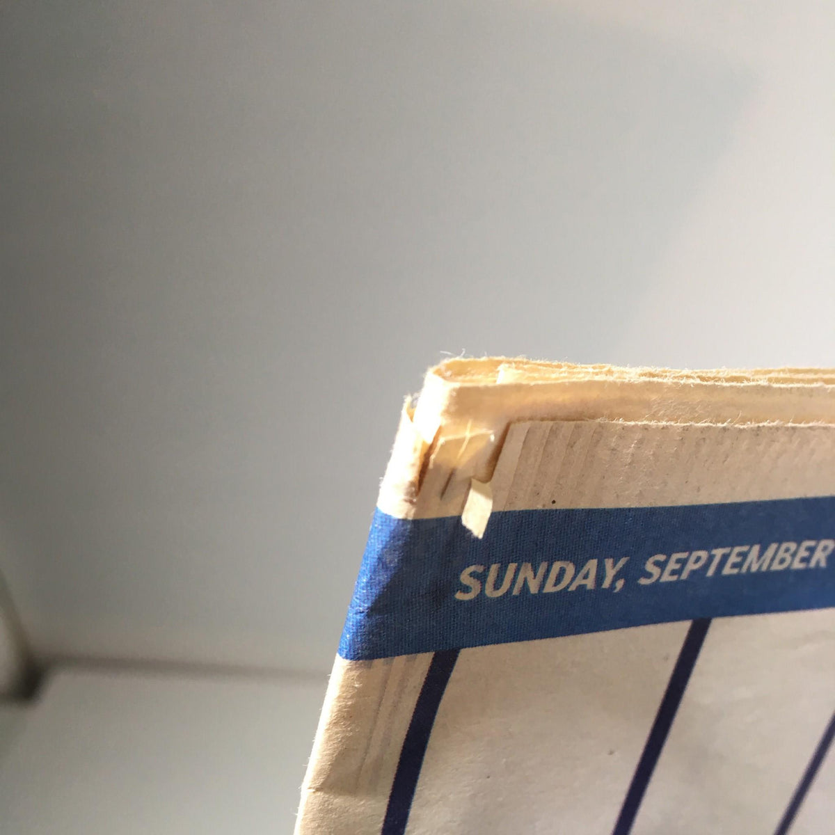 Edge detail of the NY Daily News from September 12, 2009, showing minor damage, relevant to the collectible magazine featuring 'The King, The Hit, Hot Bat, Early Years Derek Jeter'.