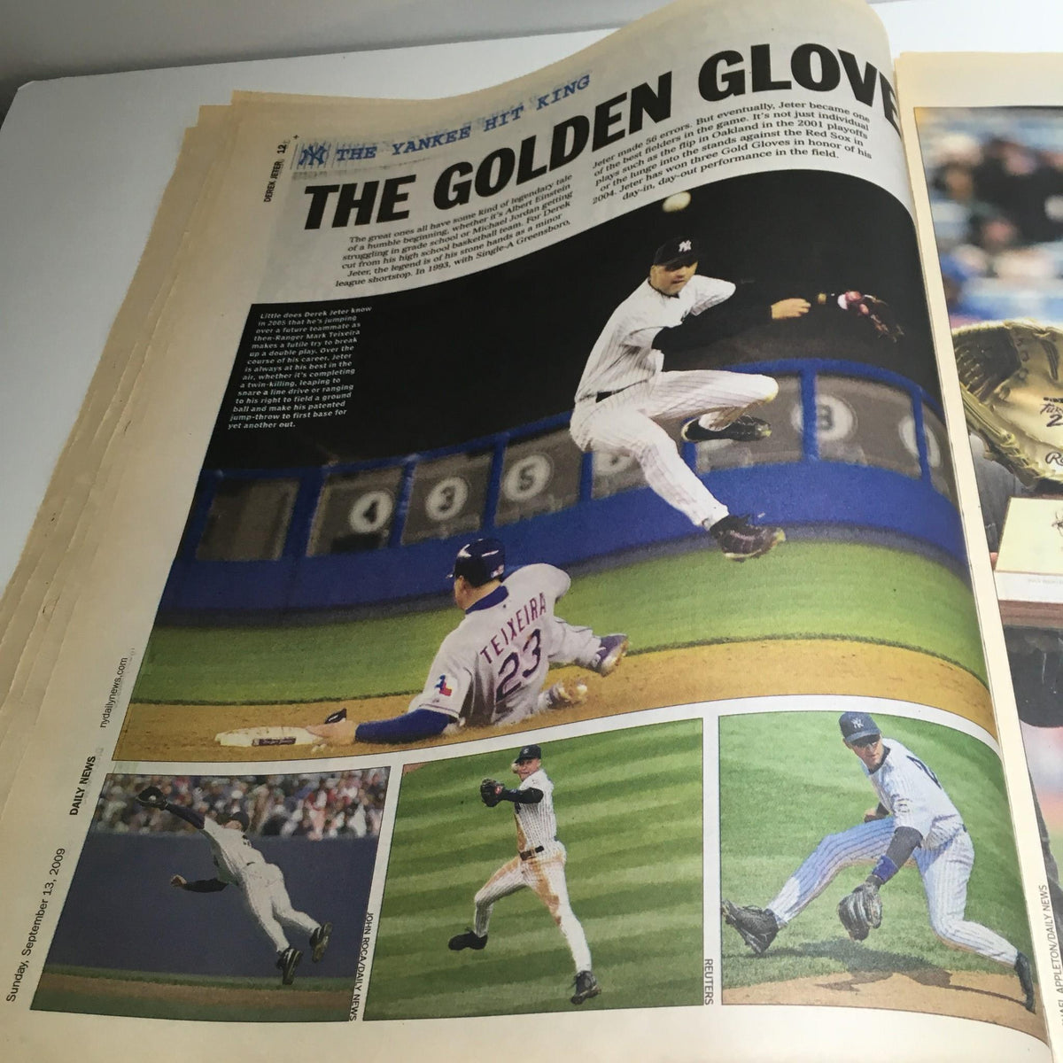 Image from NY Daily News titled 'The King, The Hit, Hot Bat, Early Years Derek Jeter', highlighting Derek Jeter making impressive defensive plays, emphasizing his Golden Glove achievements.
