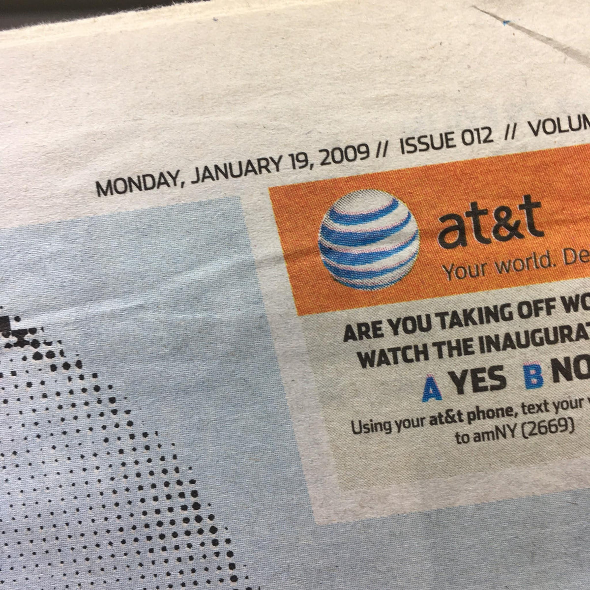Close-up of the header from AM New York newspaper, dated January 19, 2009, advertising AT&T regarding following Barack Obama’s inauguration.