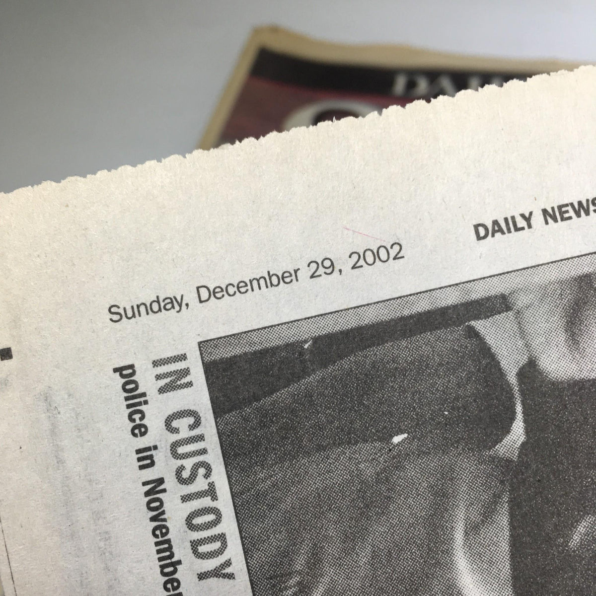 Detail from New York Daily News dated December 29, 2002, displaying the date and headline related to a significant news event.